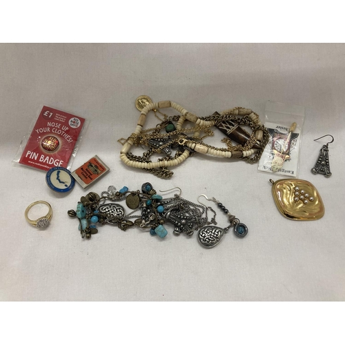 297 - A QUANTITY OF COSTUME JEWELLERY AND BADGES TO INCLUDE A RING, BRACELET, NECKLACES, CHAINS, ETC