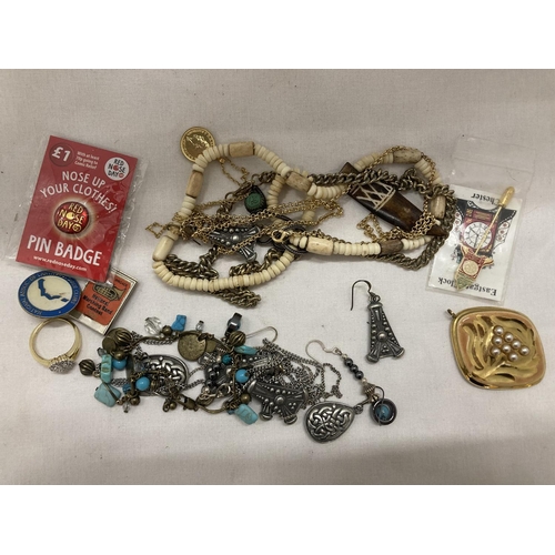 297 - A QUANTITY OF COSTUME JEWELLERY AND BADGES TO INCLUDE A RING, BRACELET, NECKLACES, CHAINS, ETC