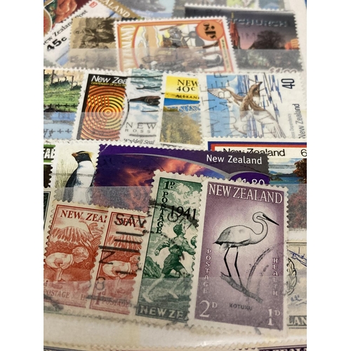 375 - TWO ALBUMS CONTAINING STAMPS OF NEW ZEALAND