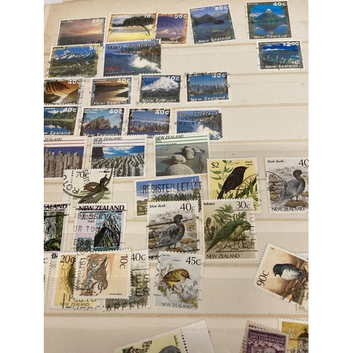 375 - TWO ALBUMS CONTAINING STAMPS OF NEW ZEALAND