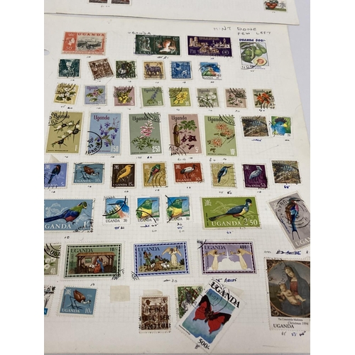 383 - TEN PLUS SHEETS CONTAINING STAMPS FROM UGANDA