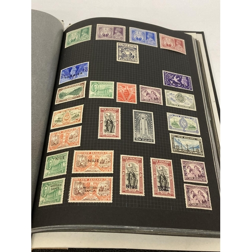 395 - AN ALBUM CONTAINING BLOCKS OF STAMPS TO INCLUDE COMMEMORATIVE, ETC.,