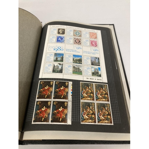 395 - AN ALBUM CONTAINING BLOCKS OF STAMPS TO INCLUDE COMMEMORATIVE, ETC.,