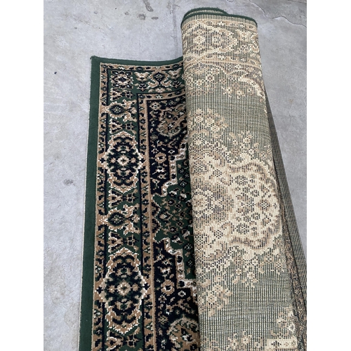 2481A - TWO SMALL GREEN PATTERNED RUGS