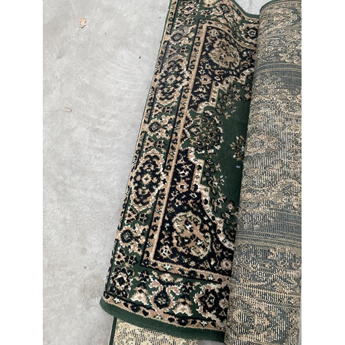 2481A - TWO SMALL GREEN PATTERNED RUGS