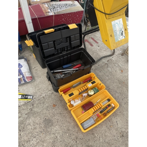 2068 - A PLASTIC STACKING TOOL BOX WITH AN ASSORTMENT OF TOOLS TO INCLUDE CHISELS ETC