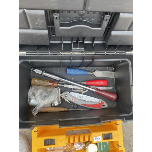 2068 - A PLASTIC STACKING TOOL BOX WITH AN ASSORTMENT OF TOOLS TO INCLUDE CHISELS ETC