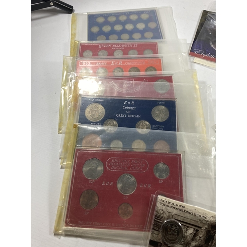 315 - A MIXED LOT OF COINS TO INCLUDE SIX CASED UK SETS , VARIOUS UK COINS IN TUBS , PLUS A BLACK STORAGE ... 