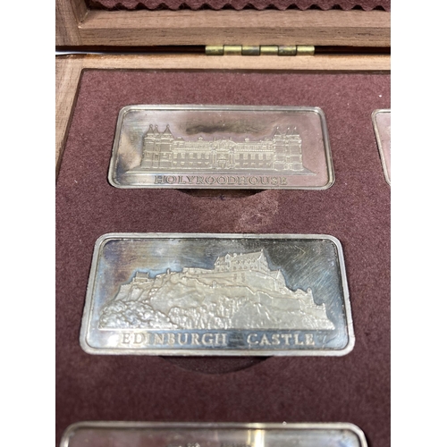 317 - A CASED COLLECTION OF 12 SOLID SILVER INGOTS OF ROYAL PALACES BY THE BIRMINGHAM MINT A LIMITED EDITI... 