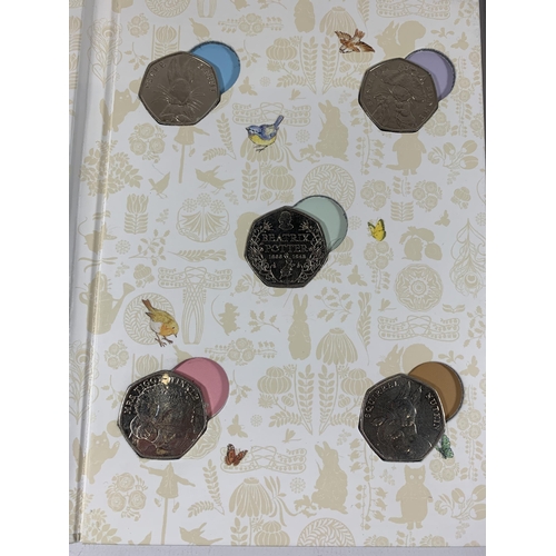 424 - A ROYAL MINT 50P COIN COLLECTOR ALBUM CELEBRATING THE WONDERFUL WORLD OF MISS POTTER TOGETHER WITH A... 