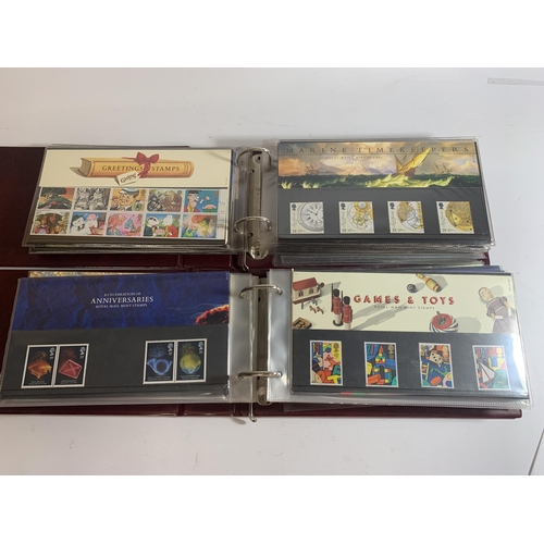 456A - TWO ROYAL MAIL FIRST DAY COVER ALBUMS TO INCLUDE THE ARMADA 1588, GAMES & TOYS, RSPCA, INLAND WATERW... 