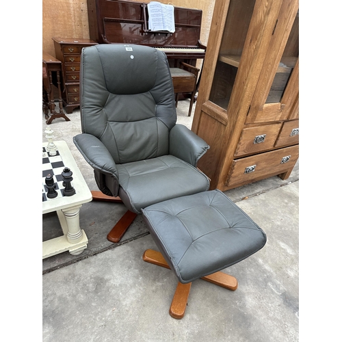 2875 - A MODERN FAUX LEATHER SWIVEL RECLINER COMPLETE WITH STOOL