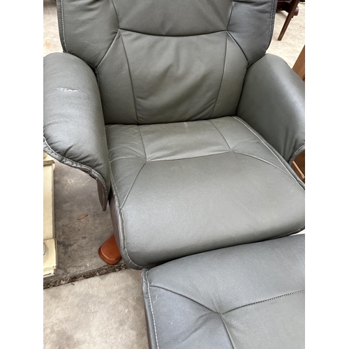 2875 - A MODERN FAUX LEATHER SWIVEL RECLINER COMPLETE WITH STOOL