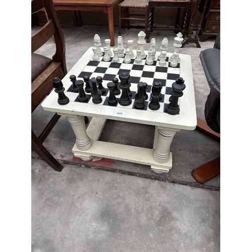 2876 - A  MODERN PAINTED CHESS TABLE COMPLETE WITH FULL SET OF PIECES