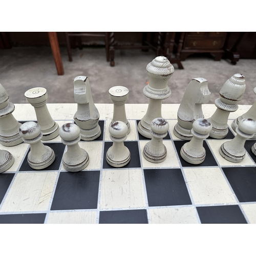 2876 - A  MODERN PAINTED CHESS TABLE COMPLETE WITH FULL SET OF PIECES