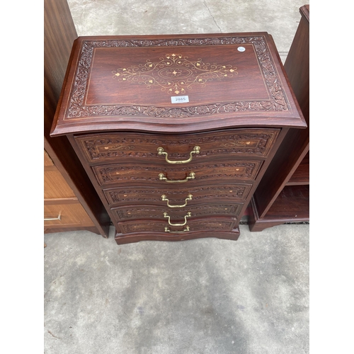 2885 - AN INDIAN HARDWOOD CARVED SERPENTINE FRONTED CHEST OF FIVE DRAWERS INSET WITH RBASS, 21