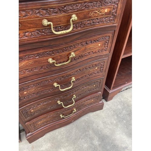 2885 - AN INDIAN HARDWOOD CARVED SERPENTINE FRONTED CHEST OF FIVE DRAWERS INSET WITH RBASS, 21