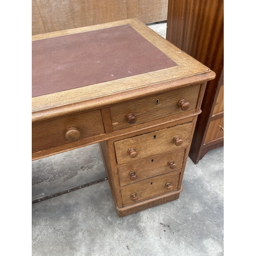 2887 - A VICTORIAN OAK TWIN PEDESTAL DESK ENCLOSING NINE DRAWERS, 47 X 25