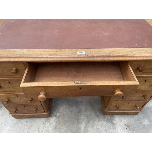 2887 - A VICTORIAN OAK TWIN PEDESTAL DESK ENCLOSING NINE DRAWERS, 47 X 25