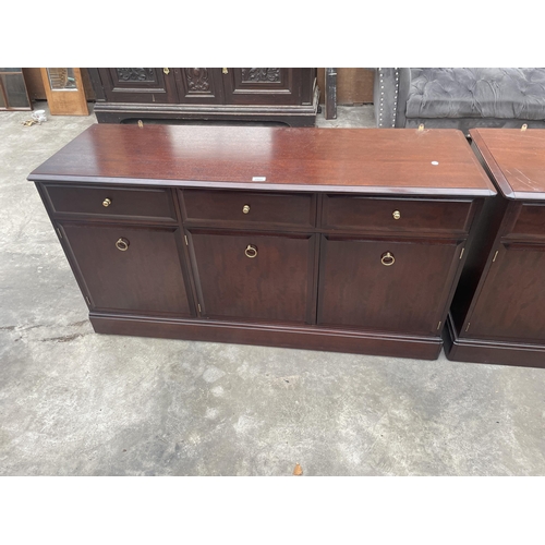 2902 - A STAG MINSTREL SIDEBOARD ENCLOSING THREE DRAWERS AND THREE CUPBOARDS, 54