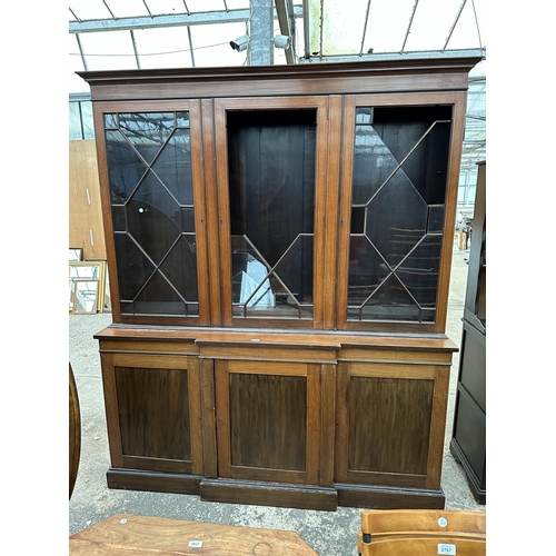 2904 - AN EDWARDIAN MAHOGANY AND INLAID BREAKFRONT TWO DOOR BOOKCASE ON BASE, 74