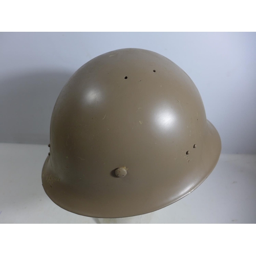 301 - A PAINTED METAL MILITARY HELMET AND LINING