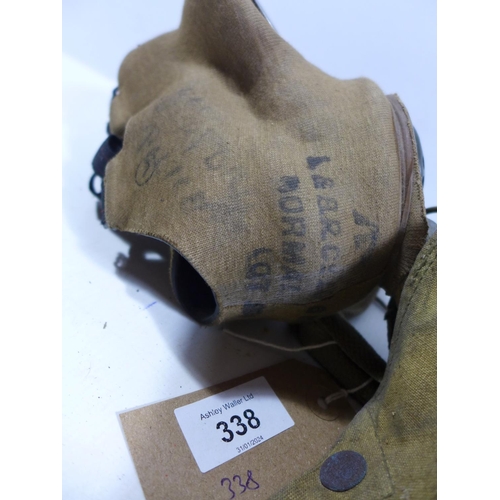 338 - A WORLD WAR II MILITARY ISSUE GAS MASK AND BAG