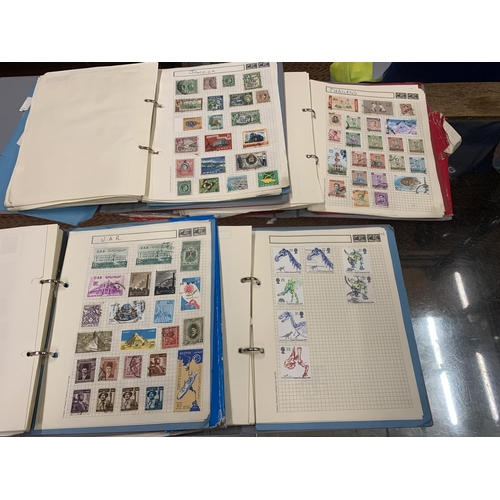 494 - FOUR STAMP ALBUMS CONTAINING WORLD STAMPS