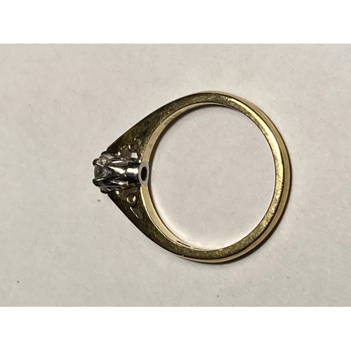 502 - AN 18 CARAT GOLD DIAMOND SOLITAIRE RING WITH PIERCED SHOULDERS SIZE L