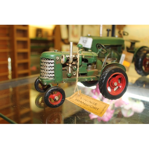 421 - 4 TRACTOR ORNAMENTS + VAT