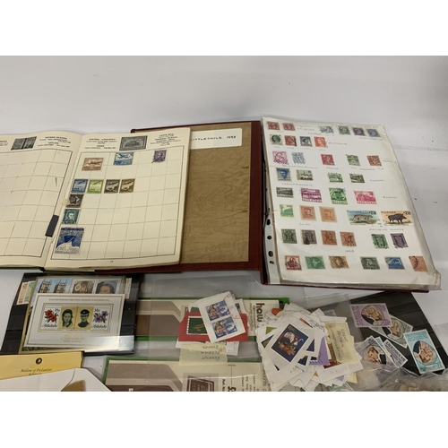 442A - TWO STAMP ALBUMS CONTAINING STAMPS FROM AROUND THE WORLD TOGETHER WITH A QUANTITY OF LOOSE STAMPS AN... 