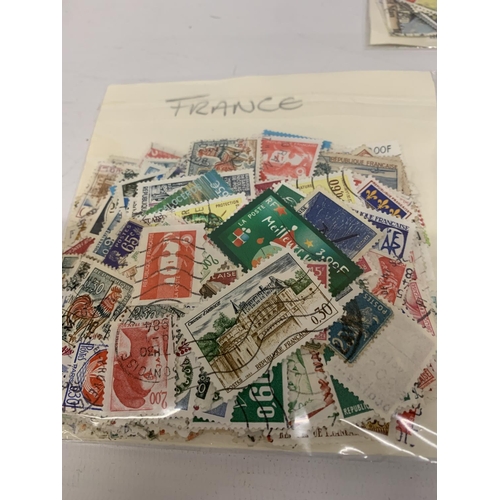 496A - EIGHT BAGS OF LOOSE STAMPS TO INCLUDE FRANCE, BAILWICK OF GUERNSEY, ISLE OF MAN, AFRICA, ETC.,