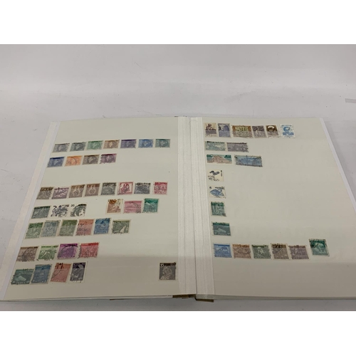 497A - A STAMP ALBUM CONTAINING STAMPS OF INDIA, PAKISTAN AND BANGLADESH