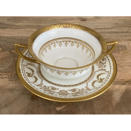 106 - AN ANTIQUE ROYAL DOULTON GILT BOUILLION CUP AND SAUCER, PATTERN NO. HN4522 TOGETHER WITH AN EDWARD V... 