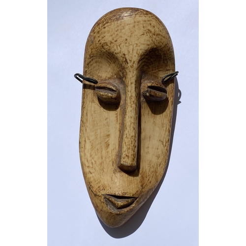 107 - FIVE VINTAGE WOODEN AFRICAN TRIBAL MASKS TO INCLUDE TWO PAIRS OF HANGING FACE ORNAMENTS - SAO TOME A... 