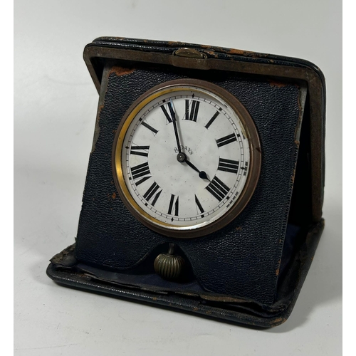 121 - A VINTAGE LEATHER CASED 8 DAY TRAVEL POCKET CLOCK