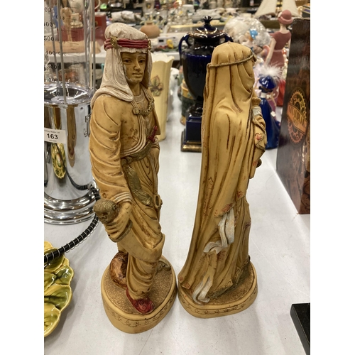 159 - TWO VERY HEAVY SHEIKH AND ARAB LADY FIGURES, HEIGHT 31CM