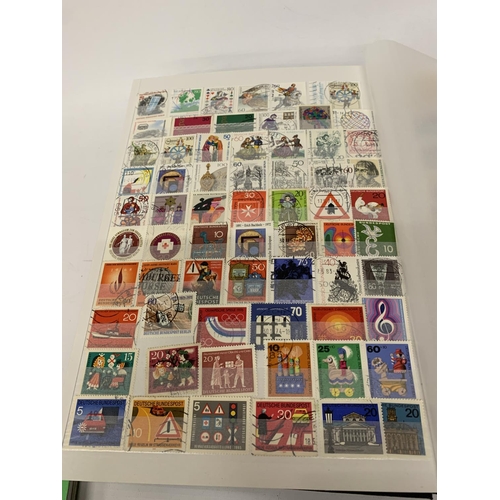 334A - A STAMP ALBUM CONTAINING STAMPS FROM GERMANY AND DDR