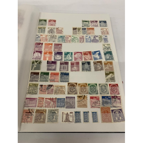 334A - A STAMP ALBUM CONTAINING STAMPS FROM GERMANY AND DDR