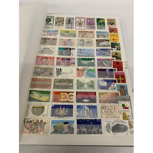 334A - A STAMP ALBUM CONTAINING STAMPS FROM GERMANY AND DDR