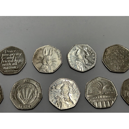 370 - ELEVEN VARIOUS COLLECTABLE FIFTY PENCE PIECES TO INCLUDE, PETER RABBIT, ETC