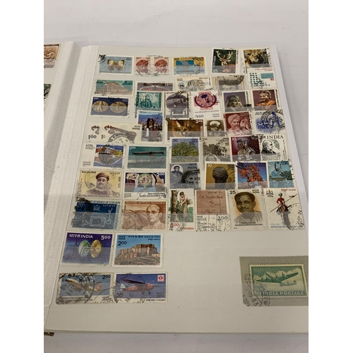 497A - A STAMP ALBUM CONTAINING STAMPS OF INDIA, PAKISTAN AND BANGLADESH