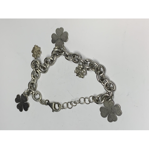 567A - TWO SILVER CHARM BRACELETS