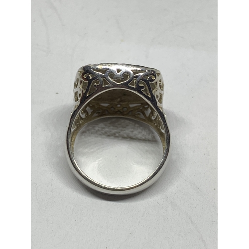 597 - AN ORNATE SILVER RING IN A PRESENTATION BOX