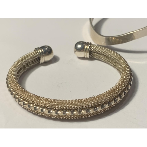 668 - TWO SILVER BANGLES