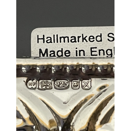 690 - A HALLMARKED SILVER PHOTOGRAPH FRAME