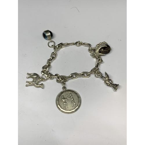 700 - TWO SILVER CHARM BRACELETS