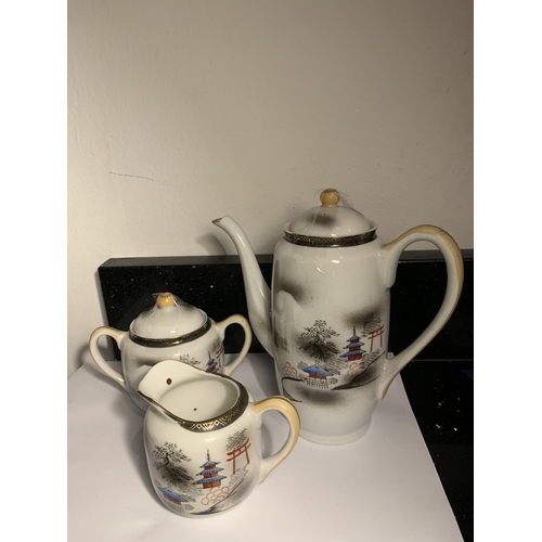 738 - AN ORIENTAL COFFEE POT WITH JUG AND LIDDED SUGAR BOWL