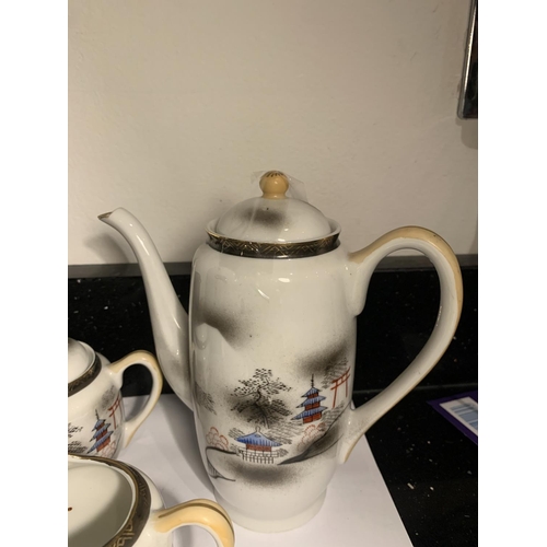 738 - AN ORIENTAL COFFEE POT WITH JUG AND LIDDED SUGAR BOWL