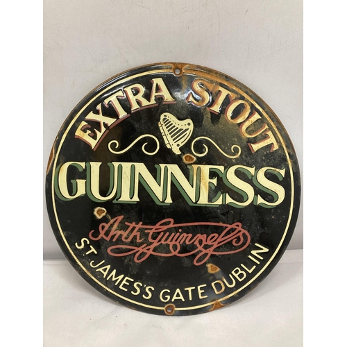 818 - AN ENAMEL EXTRA STOUT GUINNESS CIRCULAR SIGN